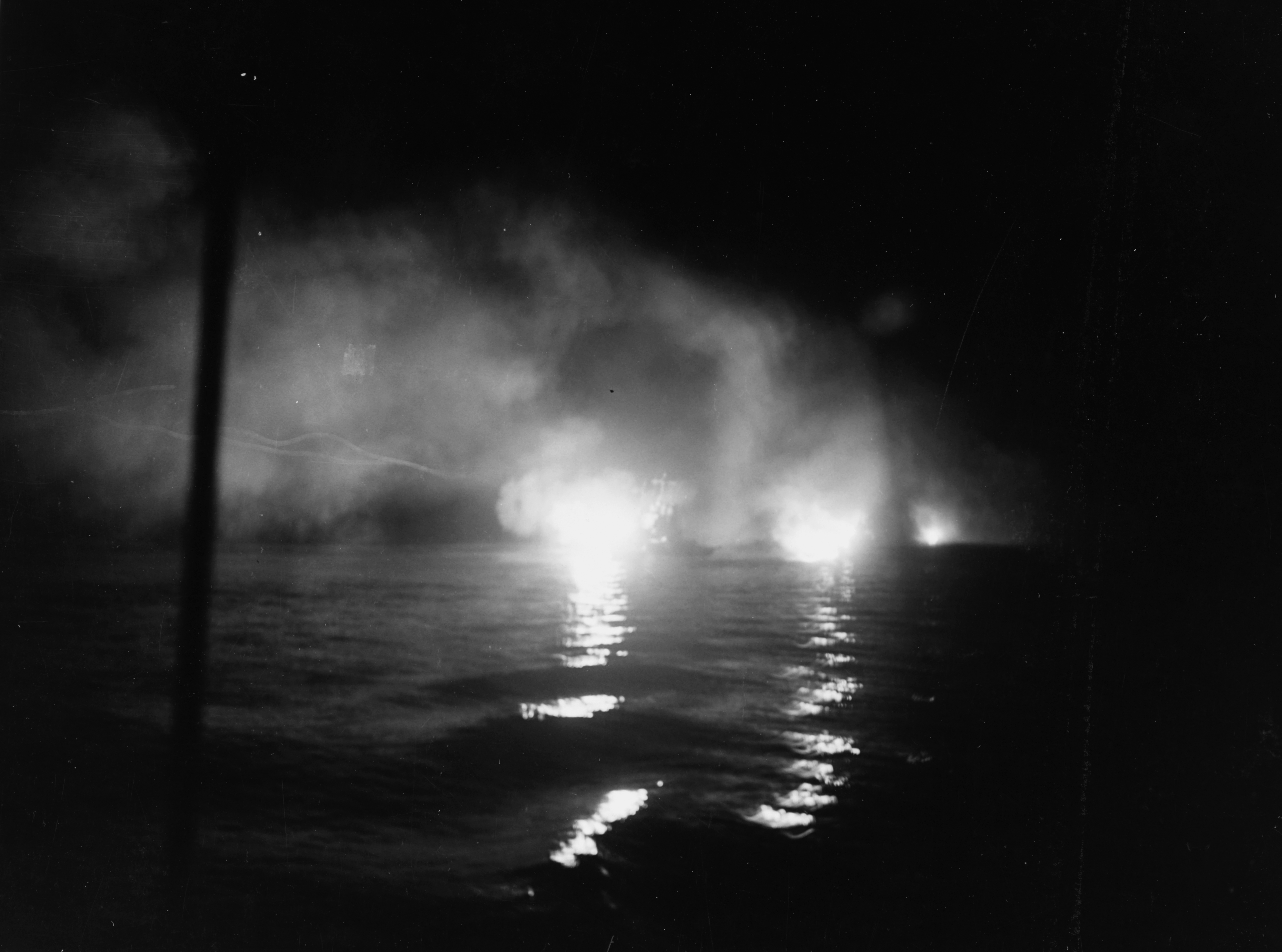 Helena firing at night in Kula Gulf, with St. Louis astern