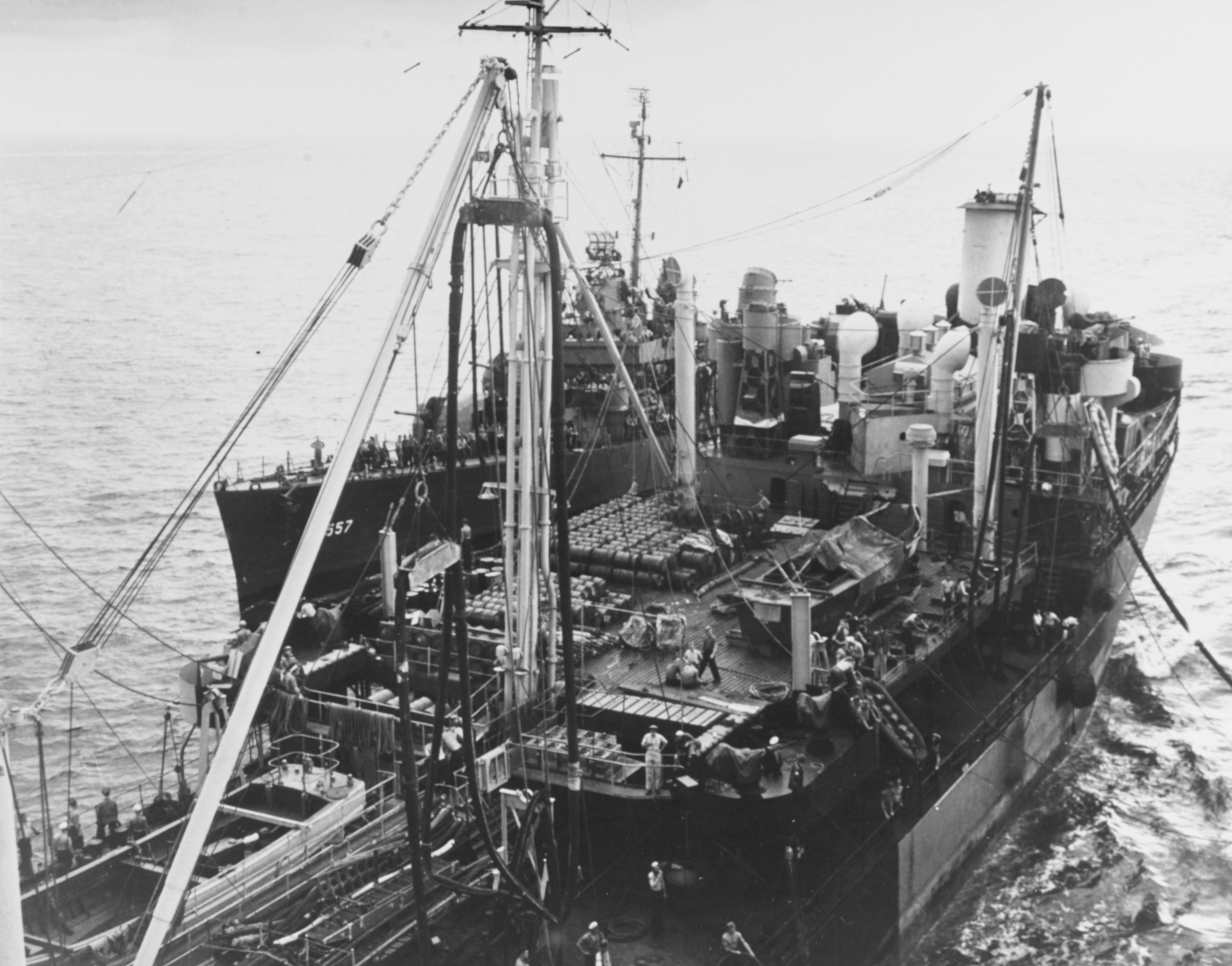 Johnston alongside the oiler Millicoma, hull number 557 visible