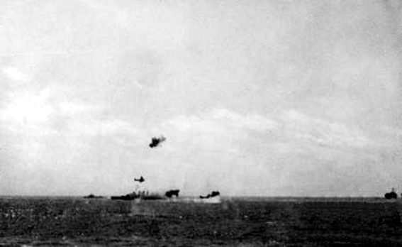 Perkins in the distance beside Australia during the Coral Sea battle