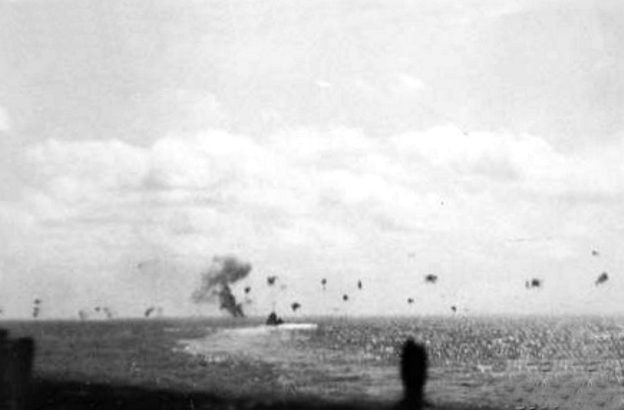 Walke under air attack, a small ship on the horizon